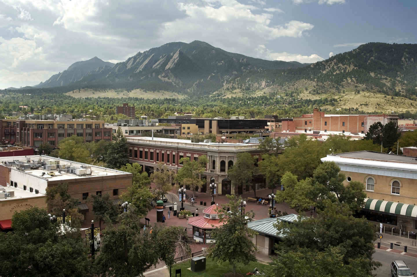 Boulder, CO as seen from the rooftop  of the City Courthouse in summer, looking down on the Pearl Street Mall and beyond to the Flatirons.